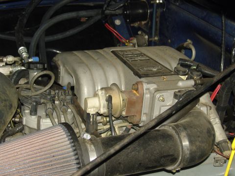 2007 Ford Mustang - Close-up of an engine intake manifold, showing the Ford logo.