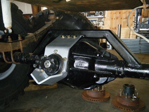 1978 Ford Bronco - The underside of a vehicle shows a detailed view of its rear axle and suspension system.