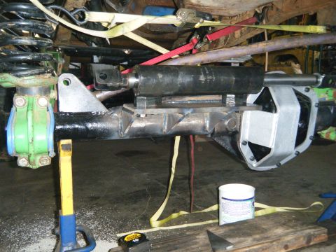 1978 Ford Bronco - Close-up of a vehicle's modified rear axle assembly, showing suspension and steering components.