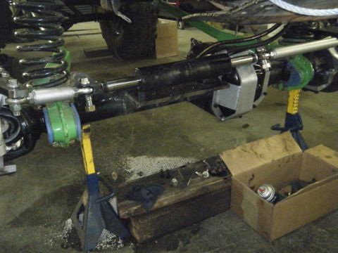1978 Ford Bronco - Power steering cylinder and linkage assembly, likely undergoing modification or repair.