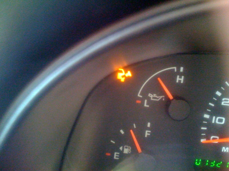 Dashboard showing oil pressure and ABS warning lights illuminated