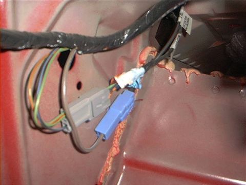 1993 Ford Taurus - Close-up of a vehicle's interior wiring harness, blue and gray electrical connectors.