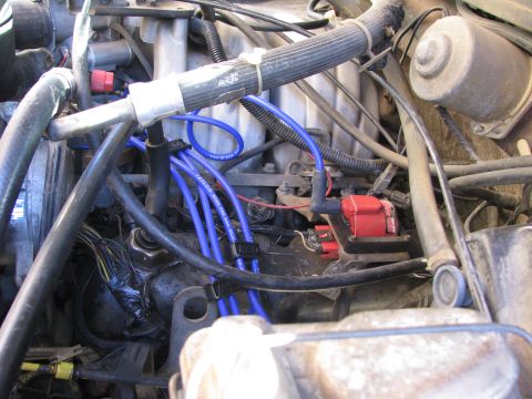 1986 Ford Bronco - moved coil from under a/c compressor to where the air filter housing used to be.