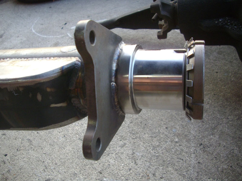 Rear axle housing with differential cover and mounting flange