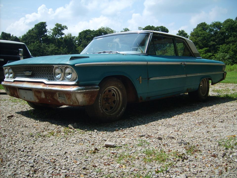 Blue 2dr sedan parts car.