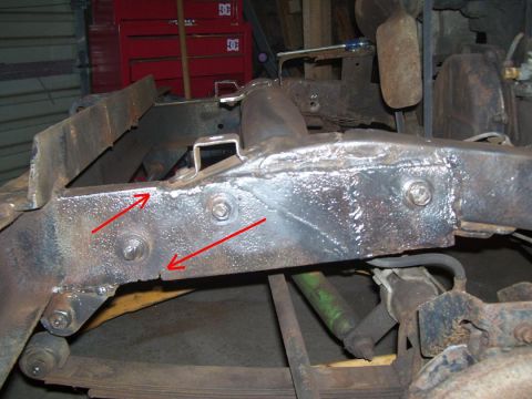 1948 Jeep Wrangler - Frame repair work on a Jeep, with arrows indicating areas of interest.