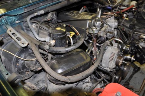 1996 Ford Bronco - Close-up view of an engine bay, showing various components and wiring.