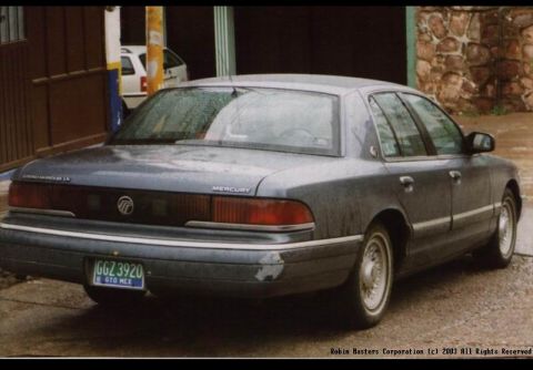 1992 Mercury Grand Marquis - A 1992 Mercury Grand Marquis sedan is parked outdoors, viewed from the rear quarter angle.
