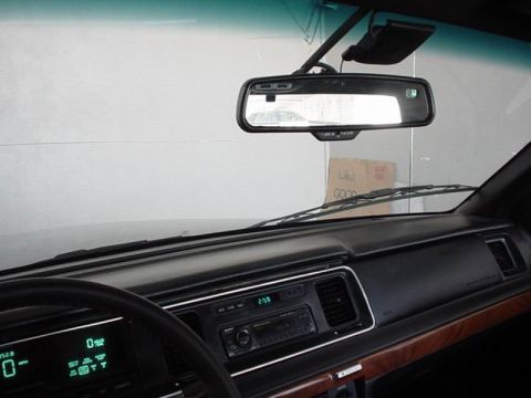 1992 Mercury Grand Marquis - Dashboard of a 1992 Mercury Grand Marquis, a digital display and wood trim.