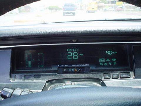 1992 Mercury Grand Marquis - The digital dashboard displays speed, range, and fuel status while driving.