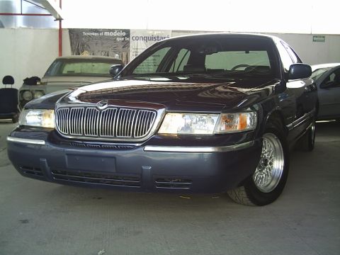 1992 Mercury Grand Marquis - Front view of a Mercury Grand Marquis, possibly from the late 1990s, parked indoors.