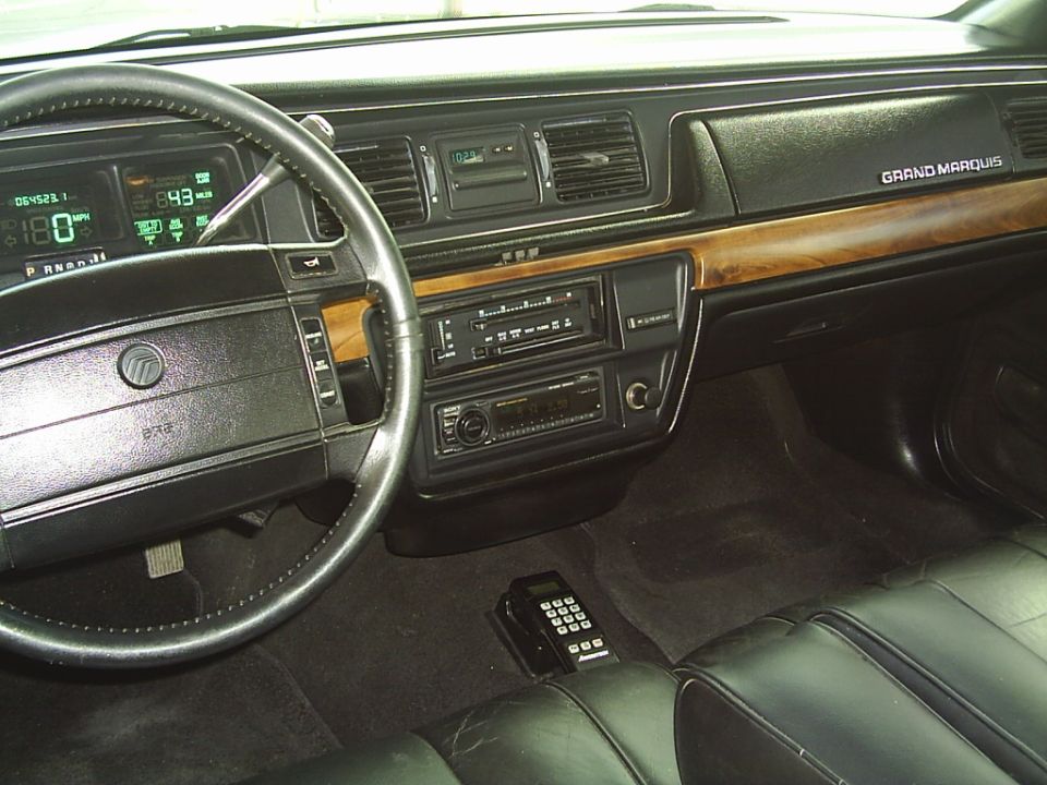 1992 Mercury Grand Marquis interior with digital dashboard and wood trim