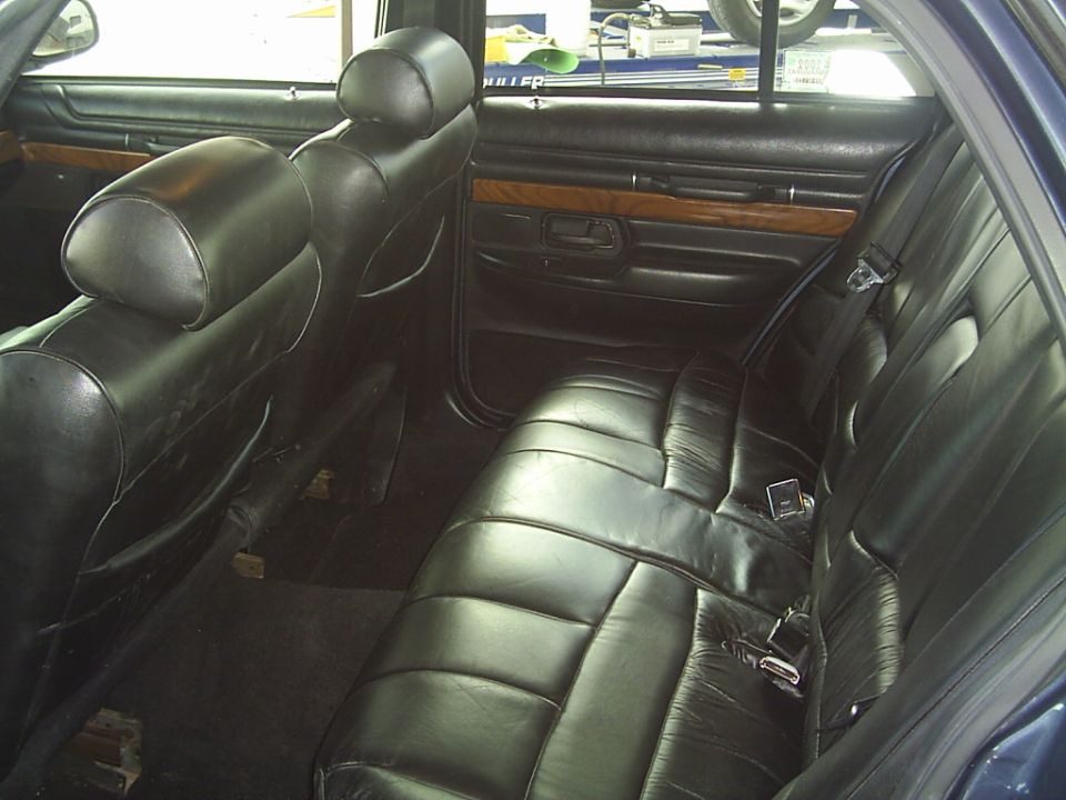 1992 Mercury Grand Marquis interior rear seats with black leather upholstery and wood trim