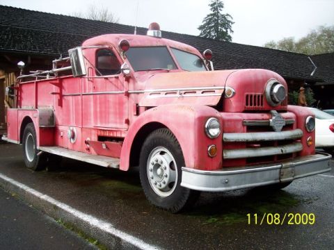 1989 Ford Bronco - This vintage red fire truck is seen from a three-quarter front perspective, with a date stamp indicating it was photographed on November 8,…