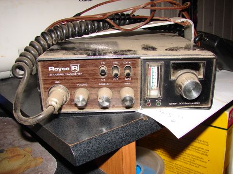 1973 Ford Ranchero - A vintage Royce 23 Channel Transceiver CB radio sits on a shelf, covered in dust.