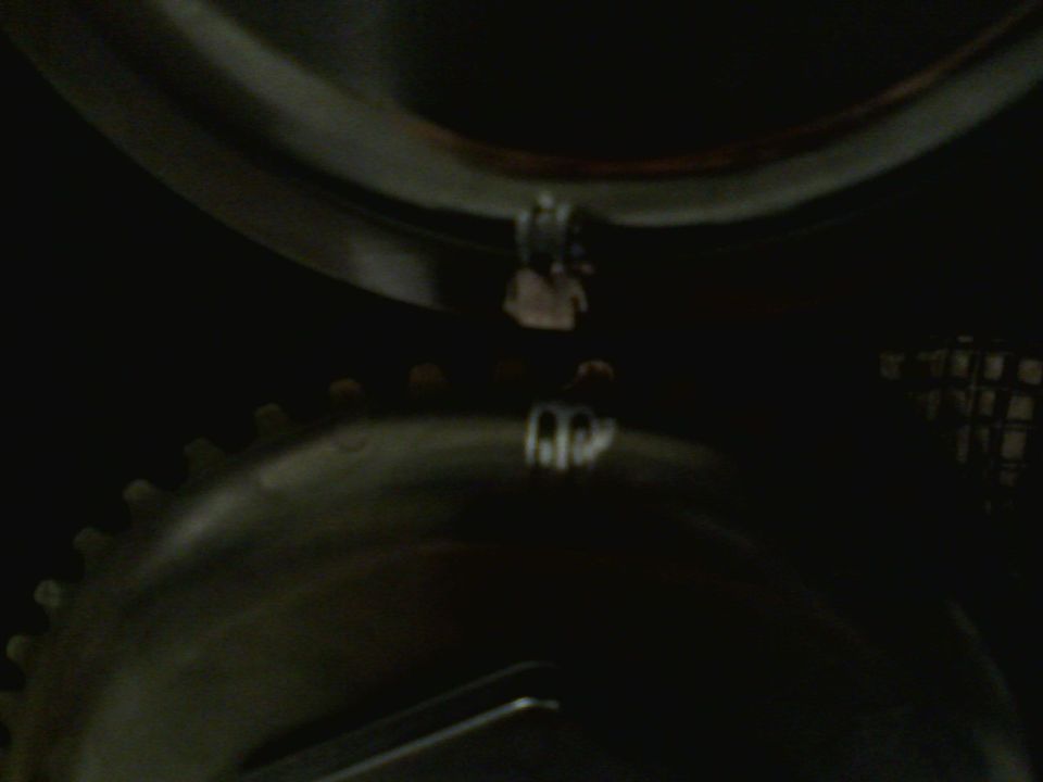 Close-up of engine gears and a hanging component