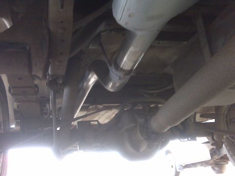 1994 Ford F-150 - Underside view shows the exhaust system and rear axle of a vehicle.
