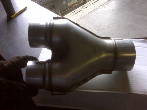 1994 Ford F-150 - A close-up view of a newly fabricated exhaust Y-pipe, ready for installation.