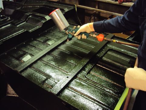 1948 Jeep Wrangler - Applying protective coating to a vehicle's floor pan.
