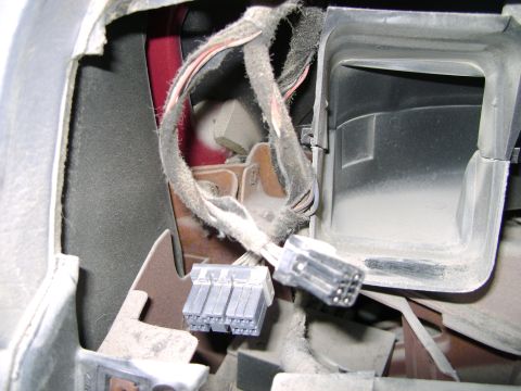 1998 Ford Crown Victoria - Close-up view of the dashboard wiring and air vent assembly in a 1998 Ford Crown Victoria.