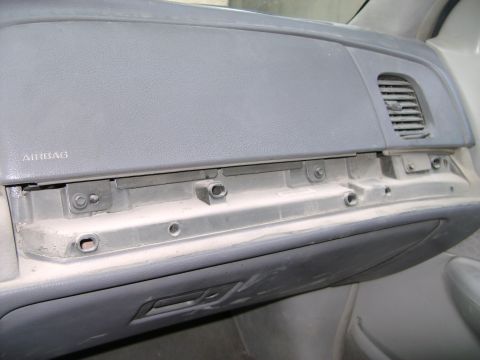 1998 Ford Crown Victoria - Dashboard interior of a 1998 Ford Crown Victoria, focusing on the airbag panel and air vent.