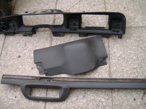 1998 Ford Crown Victoria - Disassembled dashboard components are shown laid out on a floor, with a watermark indicating 'SUPERMOTORS.NET'.
