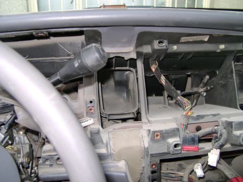 1998 Ford Crown Victoria - Interior view of a car's dashboard, showing the steering column and various electrical components.