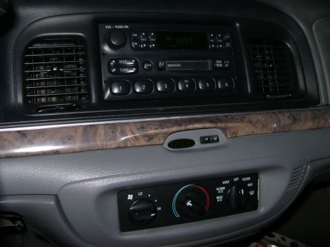 1998 Ford Crown Victoria - Interior view of a 1998 Ford Crown Victoria's dashboard, the radio and climate controls.