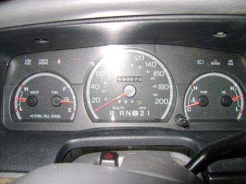 1998 Ford Crown Victoria - The vehicle's instrument cluster displays the odometer reading and various operational gauges.