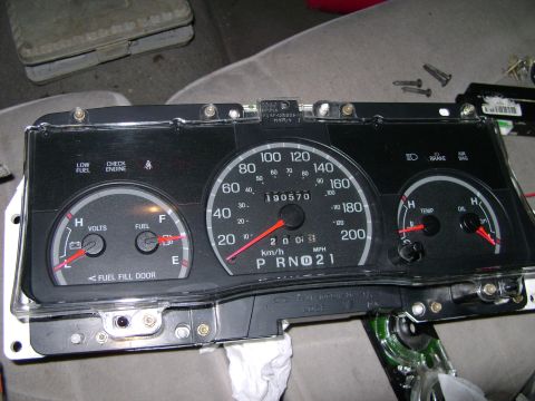1998 Ford Crown Victoria - The instrument cluster from a 1998 Ford Crown Victoria is shown, with gauges for fuel, volts, speed, temperature, and oil.