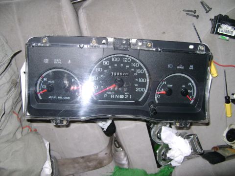 1998 Ford Crown Victoria - Instrument cluster removed from a vehicle, showing odometer reading 190570 and year 2001. Gauges for fuel, volts, temperature, and oil are…