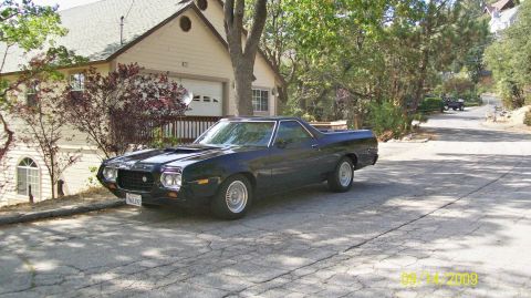 1972 Ford Ranchero - A 1972 Ford Ranchero is parked in front of a house on a sunny day.