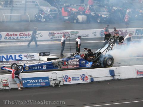 1968 Ford Mustang - A dragster sits on the track, surrounded by smoke from its tires, with "Matco Tools" branding visible.