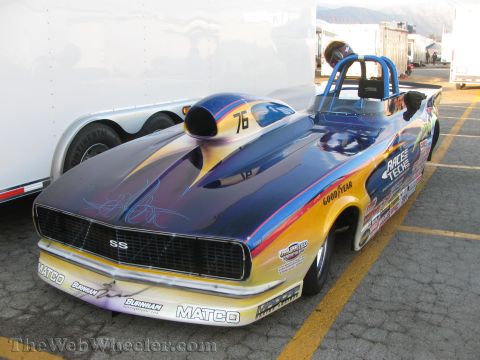 1968 Ford Mustang - This drag car features a custom paint job and numerous sponsor decals.