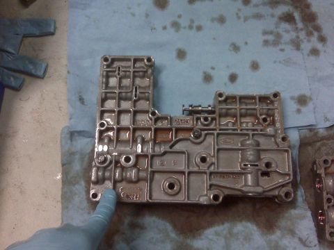 1994 Ford F-150 - Transmission valve body with Ford logo visible, likely from a truck or SUV.