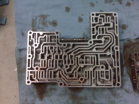 1994 Ford F-150 - Automatic transmission valve body, a complex hydraulic control unit.