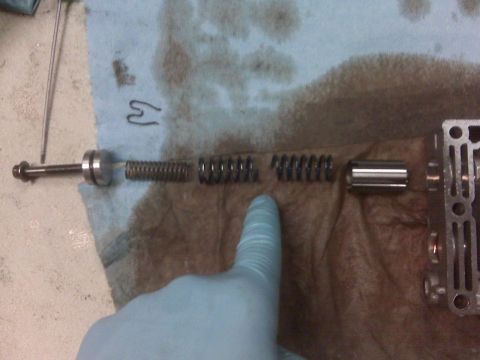 1994 Ford F-150 - Transmission valve body components, including springs and a plunger, are laid out on a shop towel.
