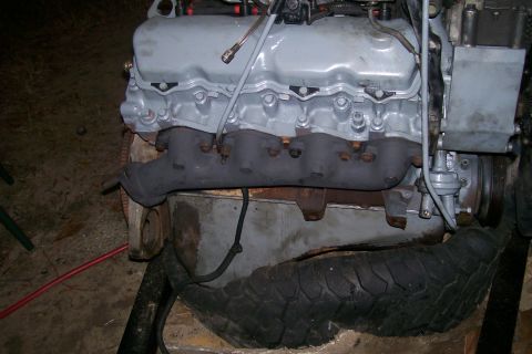 1992 Ford C-350 (Centurion Conversions) - Close-up of an engine block and exhaust manifold, likely from a truck or van.