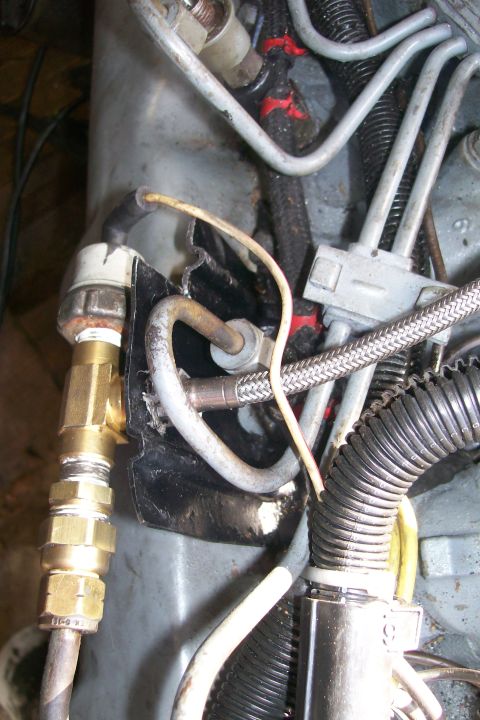 1992 Ford C-350 (Centurion Conversions) - Engine compartment details with fuel lines and wiring visible.