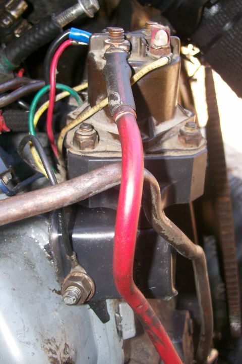 1992 Ford C-350 (Centurion Conversions) - The starter solenoid and associated wiring are visible in this close-up engine shot.