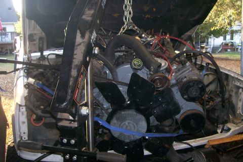 1992 Ford C-350 (Centurion Conversions) - Notice the ratchet strap I'm having to use to pull the engine back as I lower it.