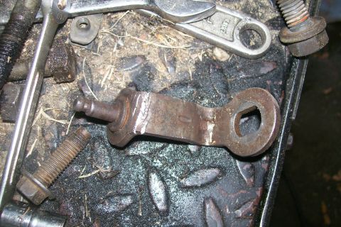 1992 Ford C-350 (Centurion Conversions) - The tranny linkage arm that had to be 'adjusted' to fit around the turbo pipes. Notice the cracks that formed from me bending it.