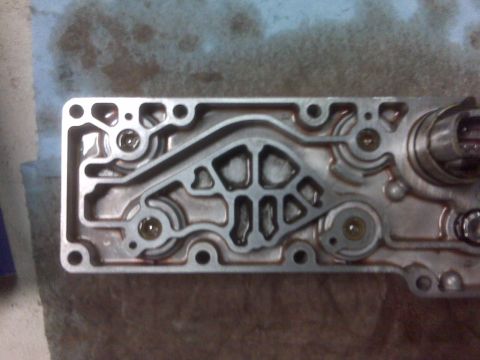 1994 Ford F-150 - Transmission valve body detail, showing internal components and fluid channels.