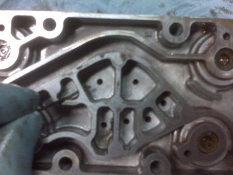 1994 Ford F-150 - A detailed view of an internal engine component, showing its intricate design and machined surfaces.