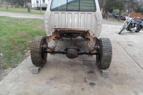1997 Ford Ranger - Rear view of a 1997 Ford Ranger chassis with the body removed, sitting on blocks.