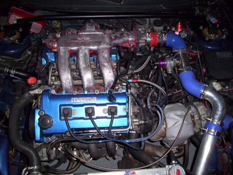 1995 Ford Probe - Customized engine bay with a turbocharger and modified intake system is visible.