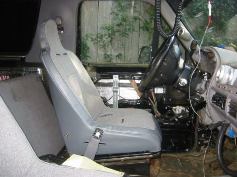 1995 Ford Bronco - Interior view of a vehicle's cabin, showing seats and dashboard components.