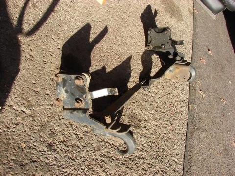 1996 Jeep Grand Cherokee - A tow hitch receiver and mounting bracket are shown lying on the ground.