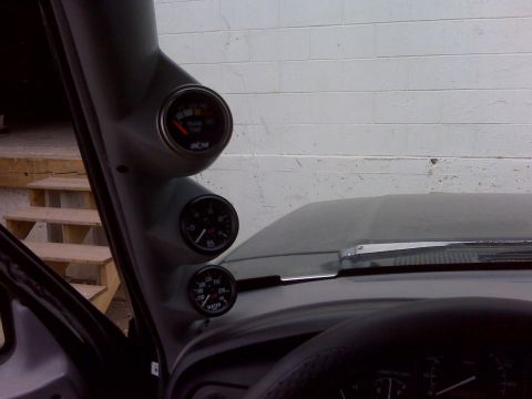 1994 Ford F-150 - A triple gauge pod is installed on the A-pillar, displaying various engine vitals.