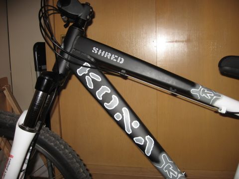 1992 Ford Ranger - Close-up of a bicycle frame with "SHRED" and other white graphics.